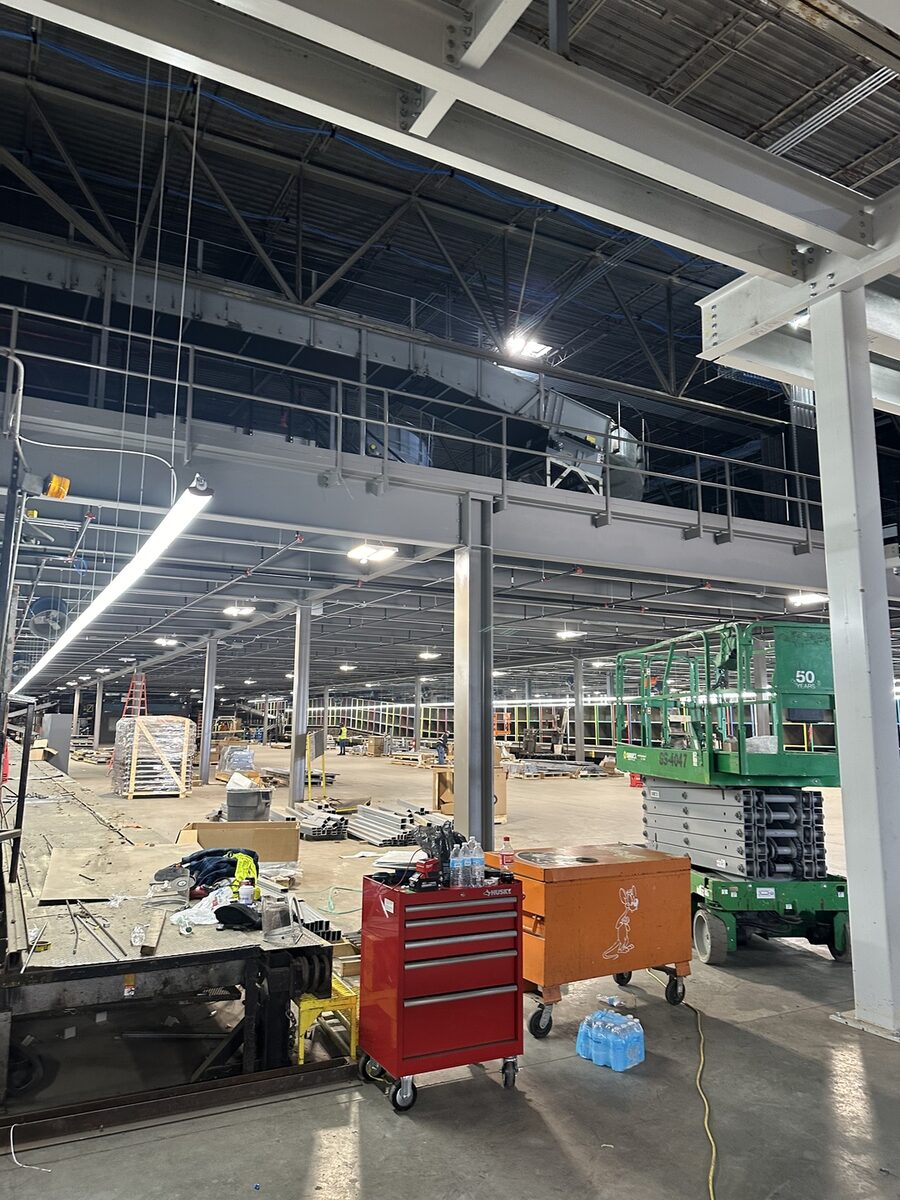 Active construction site with Zion tool chest and scissor lift